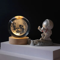 Celeste lamp shown in Moon design variant glowing softly