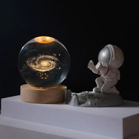 Close-up of the Celeste lamp's etched planet detail inside the crystal ball