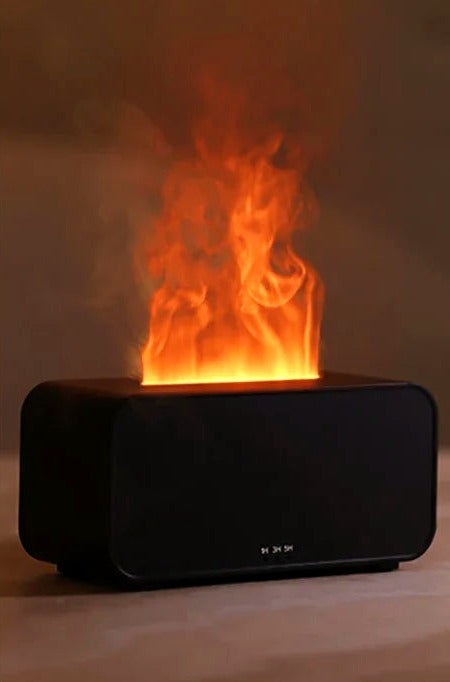 Close-up of the Lueur black diffuser's flame-effect LED light and rising mist
